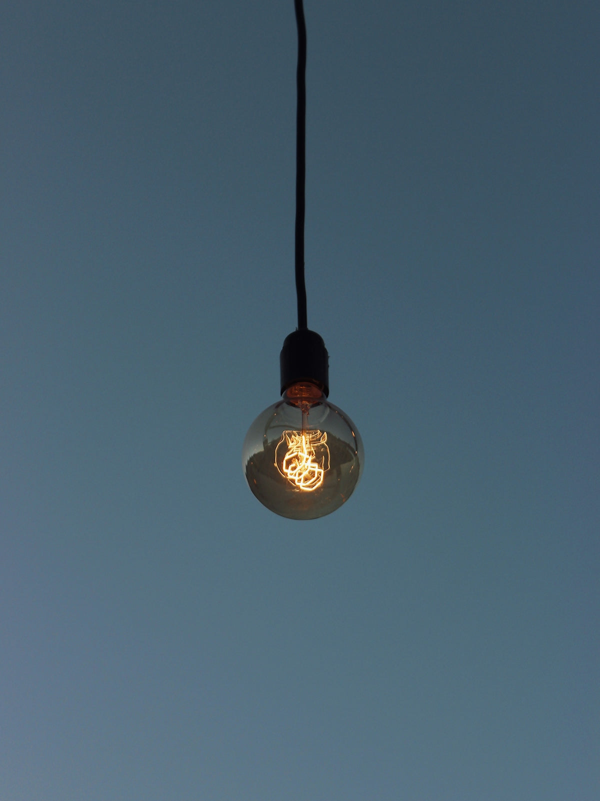 white light bulb turned on during night time