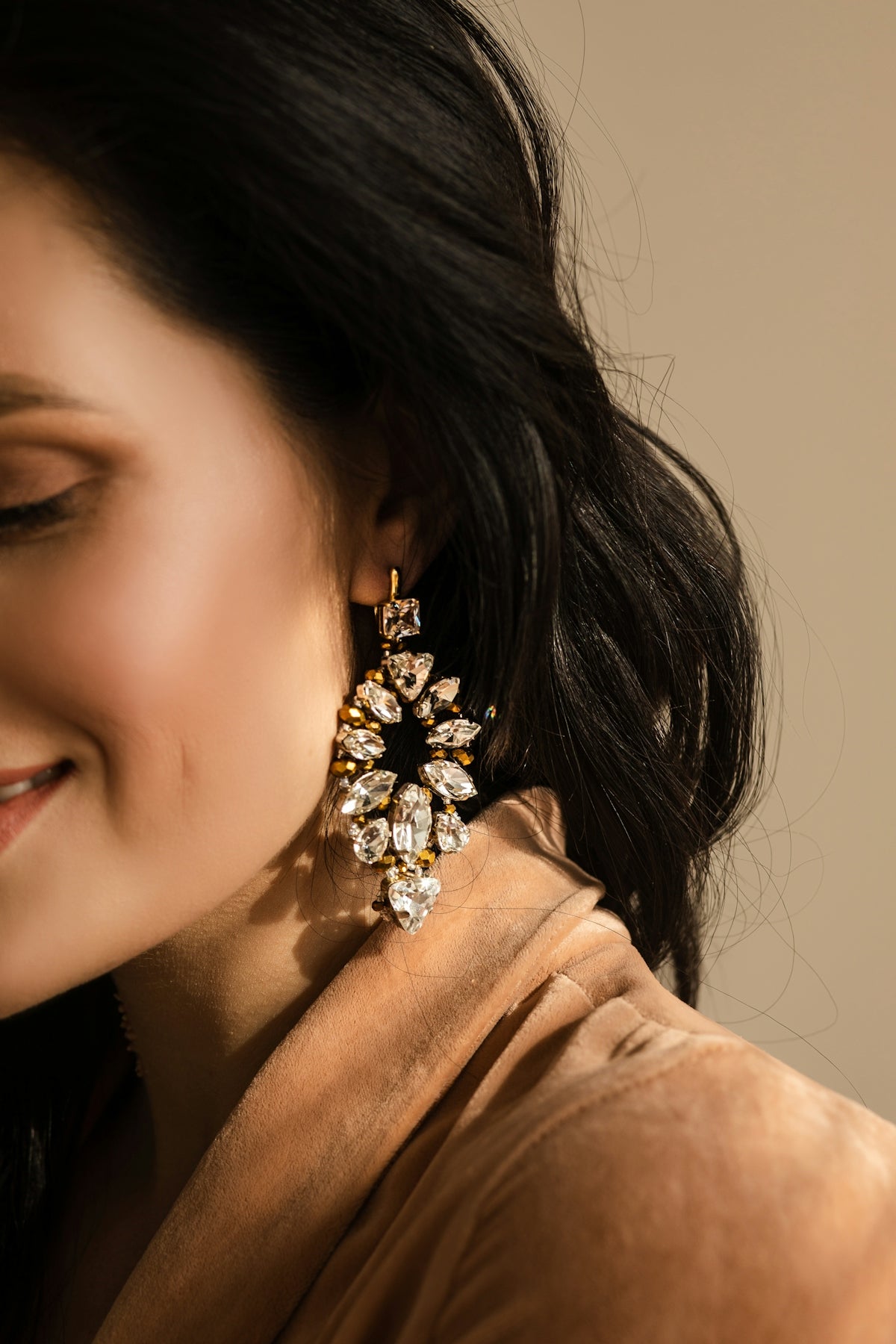 A close up of a person wearing a pair of earrings