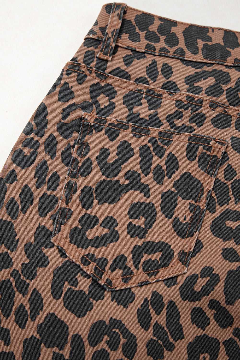 Back pocket detail of Leopard Denim Midi Skirt - Summer Fashion by FashionFitz, highlighting the all-over leopard print design.
