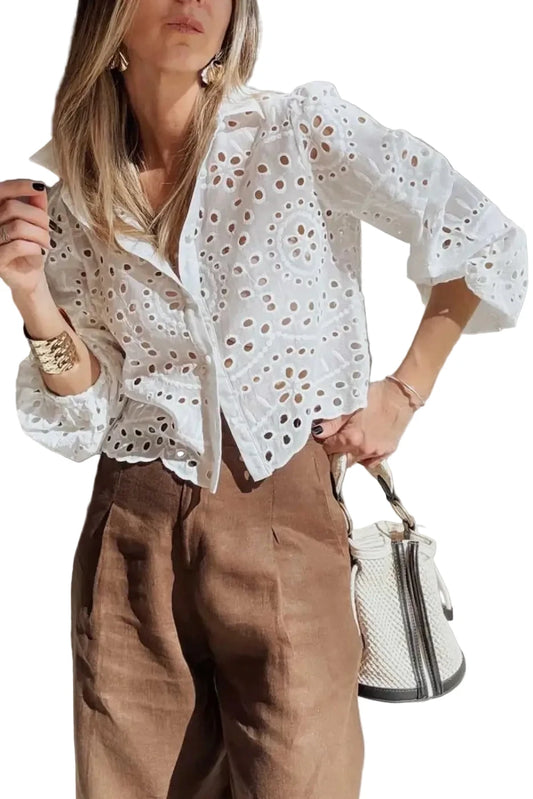 Cutwork Embroidered Crop Top in white cotton with puff sleeves, styled with brown high-waist pants for a chic spring outfit.