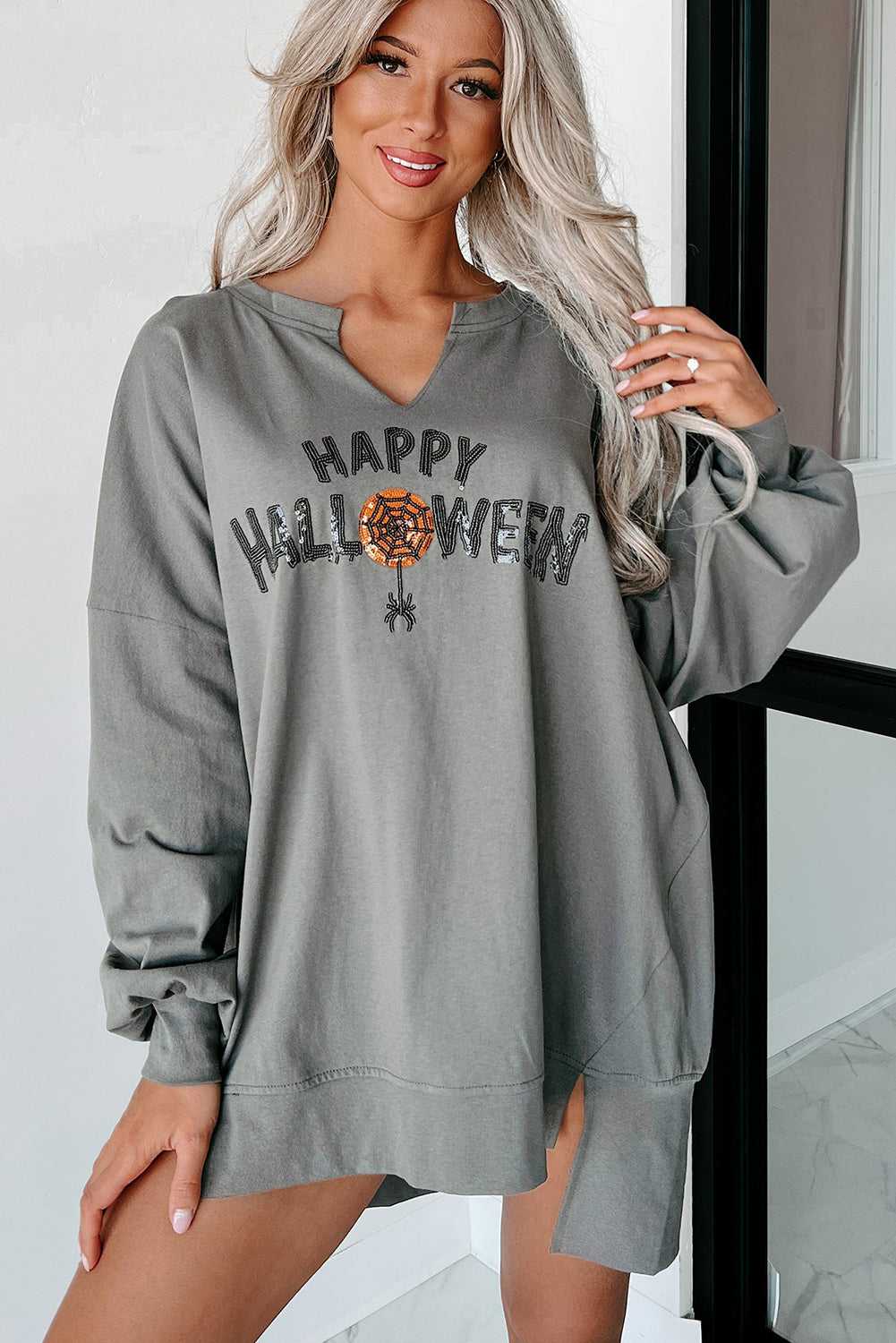 Front view of grey Sequin Halloween Top with sparkling Halloween text and relaxed silhouette, styled for casual fall fashion.