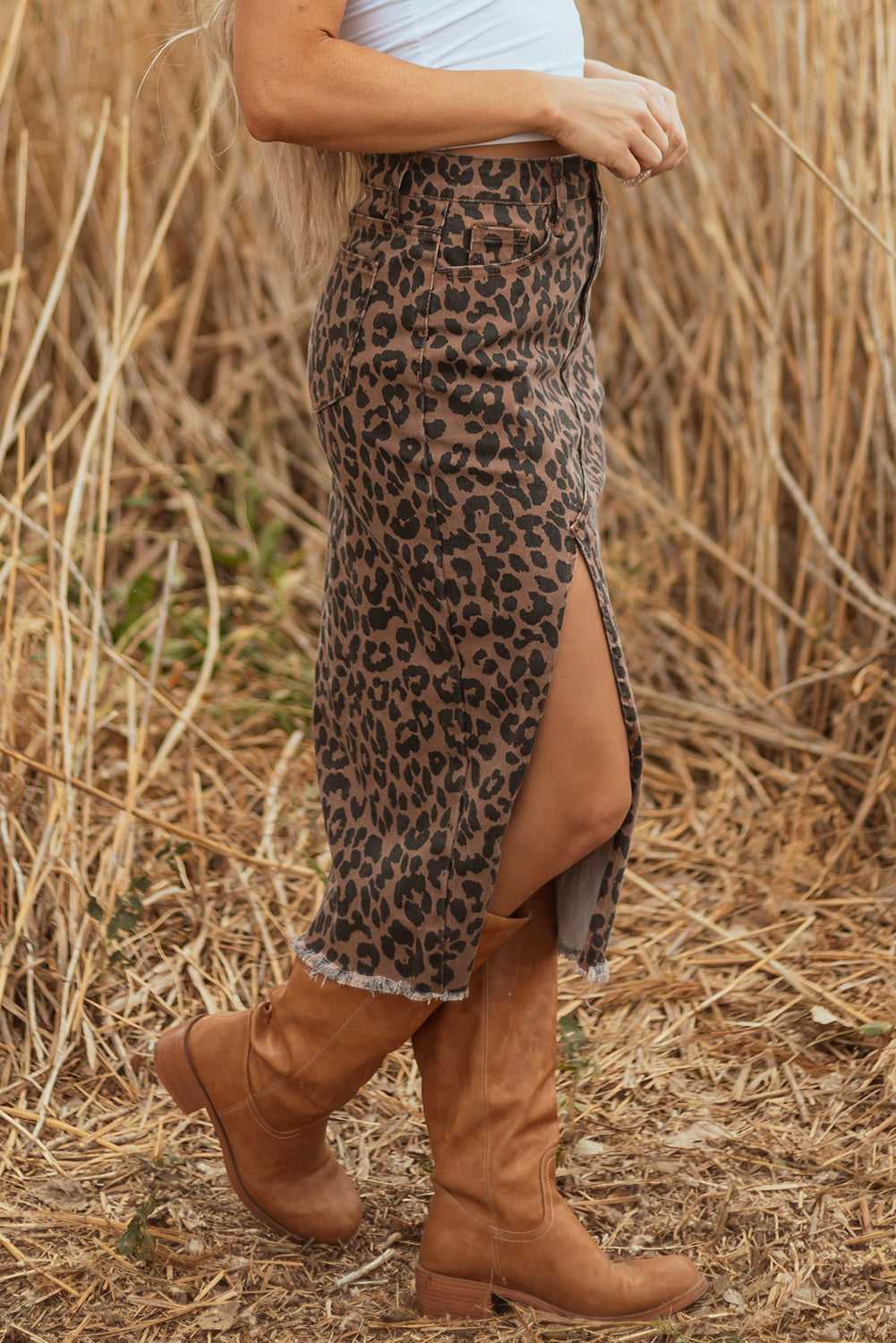 Side view of Leopard Denim Midi Skirt - Summer Fashion by FashionFitz with high slit and frayed hem, styled with boots.