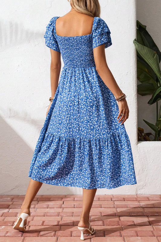 Women's floral smocked midi dress side view summer vacation