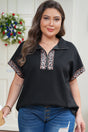 Leopard patchwork half zip plus size short sleeve top in black — front view