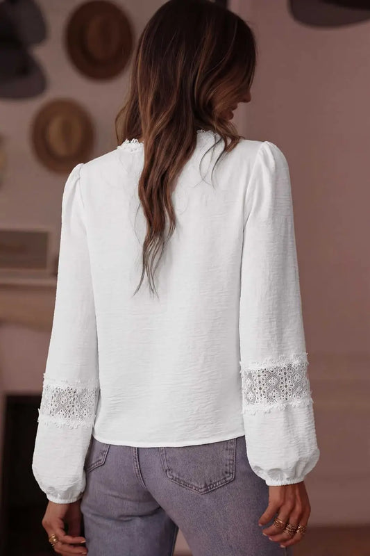 Back view of White Guipure Lace Frill Blouse showing plain back and lace-detailed long sleeves, ideal for spring and summer outfits.
