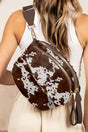 Women's cow print double zip crossbody bag front view casual