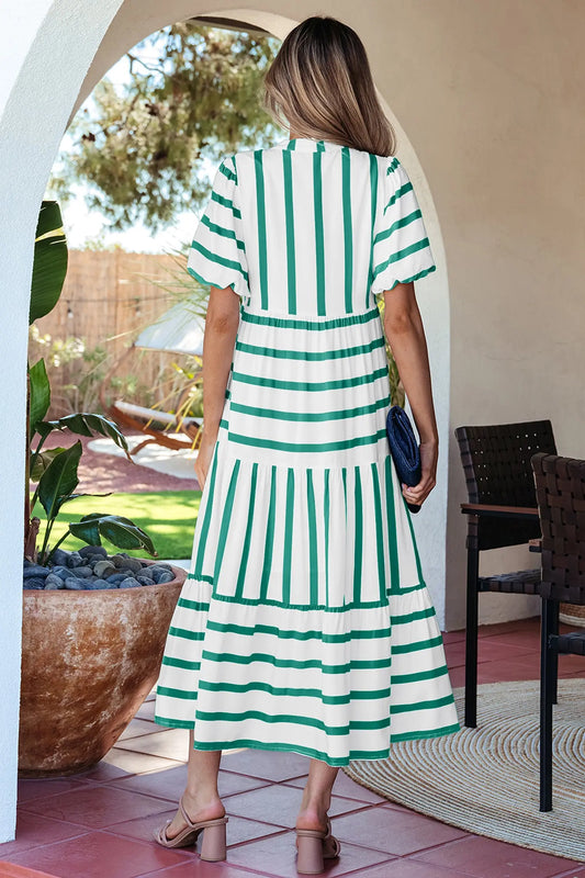 Green stripe empire waist midi dress showing ricrac trim at neckline and sleeve edges, side view, Fashionfitz