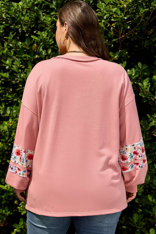 Back view of Curve Blush Peach Floral Appliqué Sweatshirt for Women showing relaxed fit and floral sleeve detail, ideal for plus size casual wear.