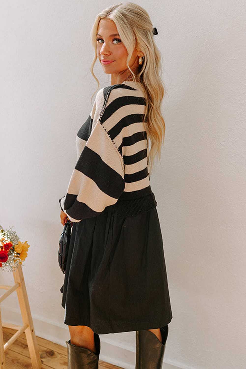 Side profile of Monochrome Knit Dress - Cozy & Stylish | FashionFitz highlighting the relaxed fit and color block design ideal for daily wear.