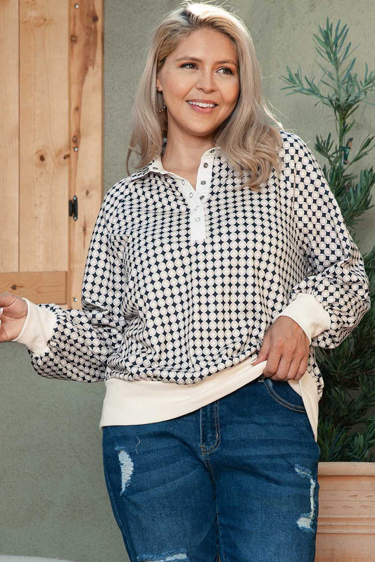 Curve Monochrome Contrast Polo Sweatshirt for Women with black and white geometric print and cream cuffs, styled casually with jeans.