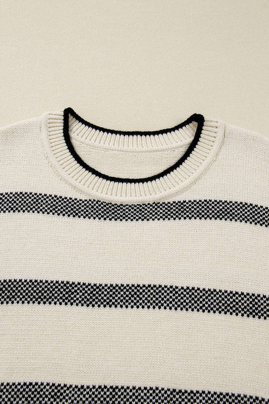 Close-up of neckline on Women's Apricot Striped Bell Sleeve Jumper, featuring ribbed collar with black trim. Highlights quality knitwear details.