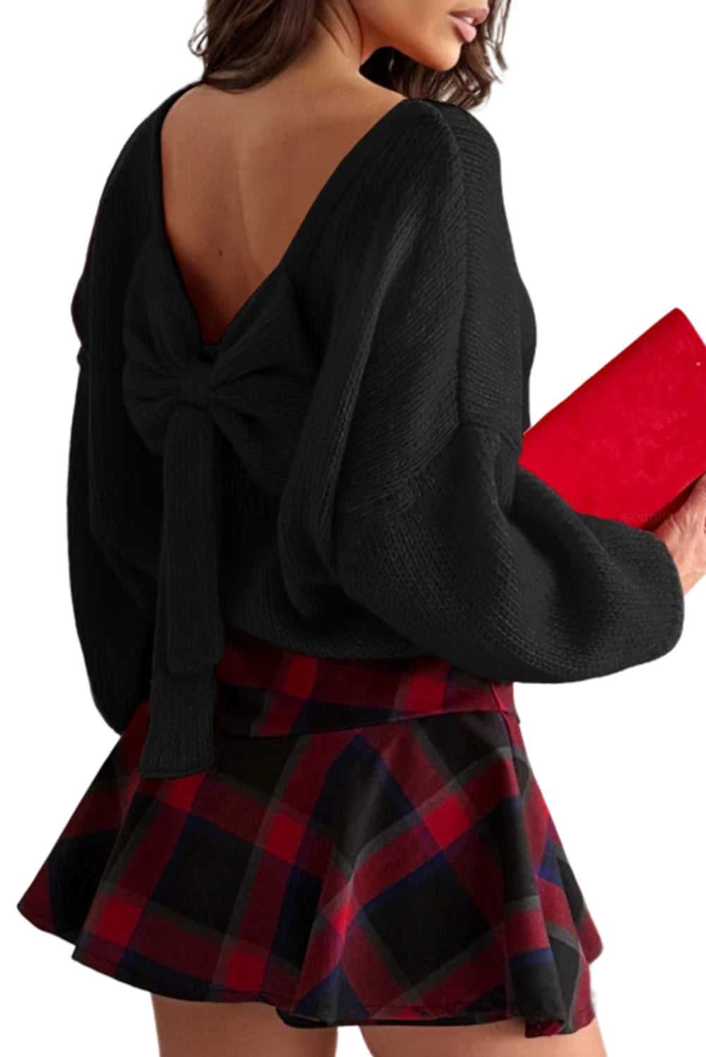 Backless design of black Women's Festive Bow‑Back Jumper featuring a statement bow, styled for autumn and holiday occasions.