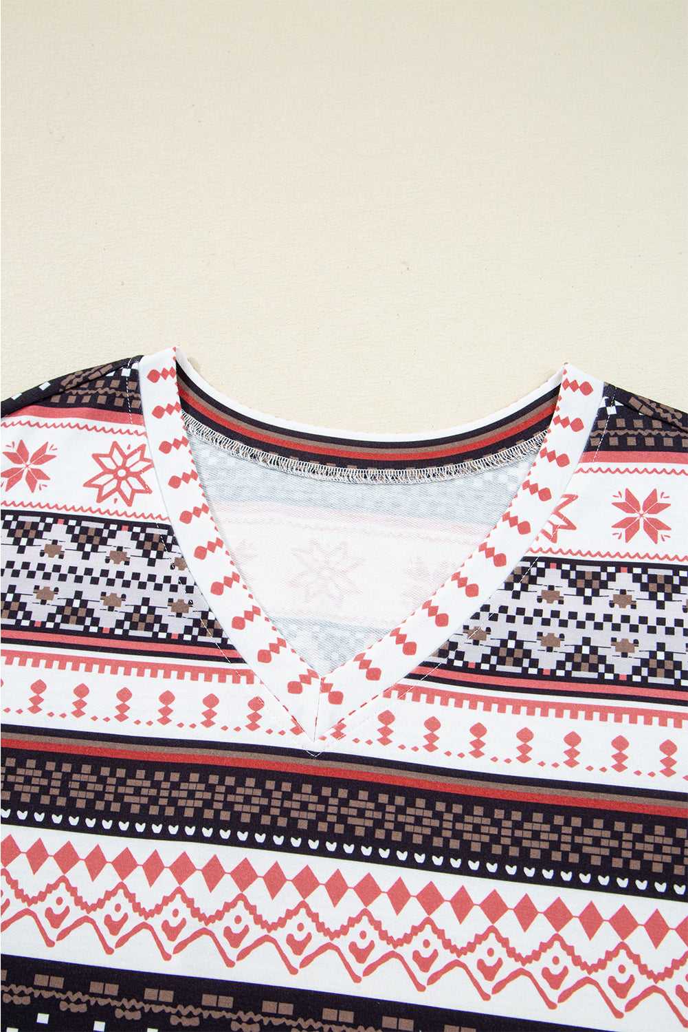Close-up of V-neck collar on Women's Christmas Comfort Lounge Set in Black by FashionFitz, highlighting detailed stitching and festive design.