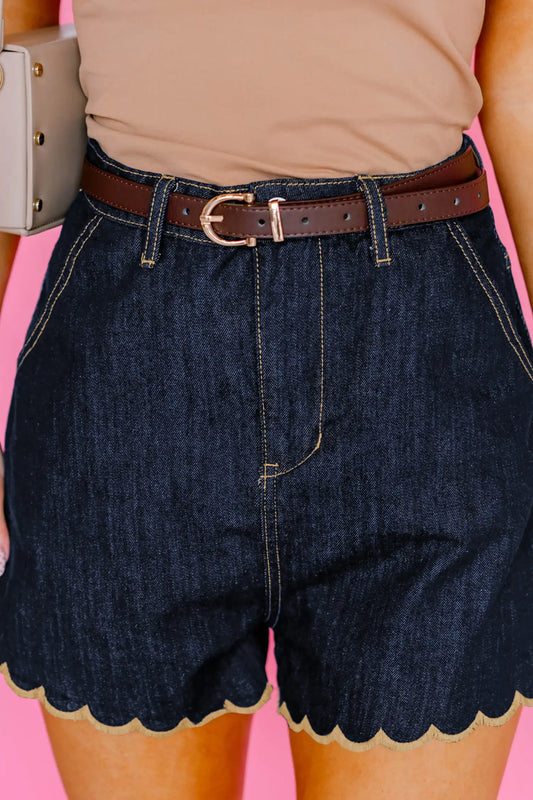 Woman wearing navy blue embroidered scalloped trim high waist denim shorts front view Fashionfitz UK