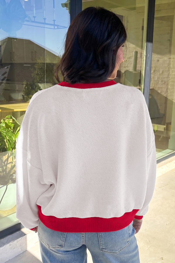 Beige festive slogan sweatshirt UK side view outfit
