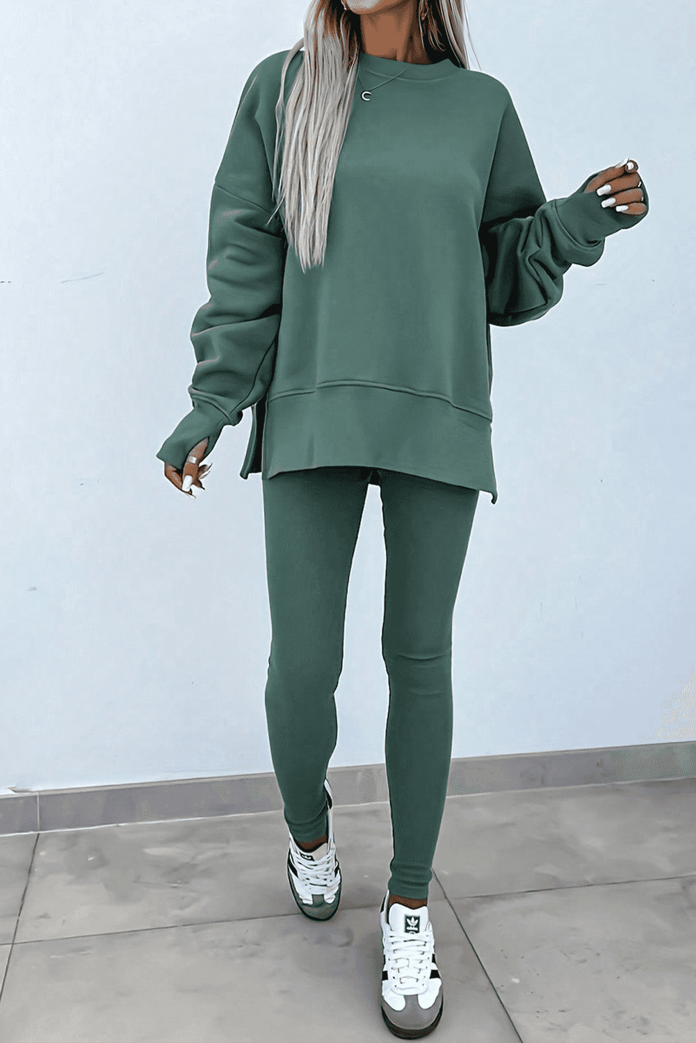 Green Women's Oversized Sweatshirt and Leggings Matching Set styled with sneakers, ideal for casual fall outfits and loungewear.