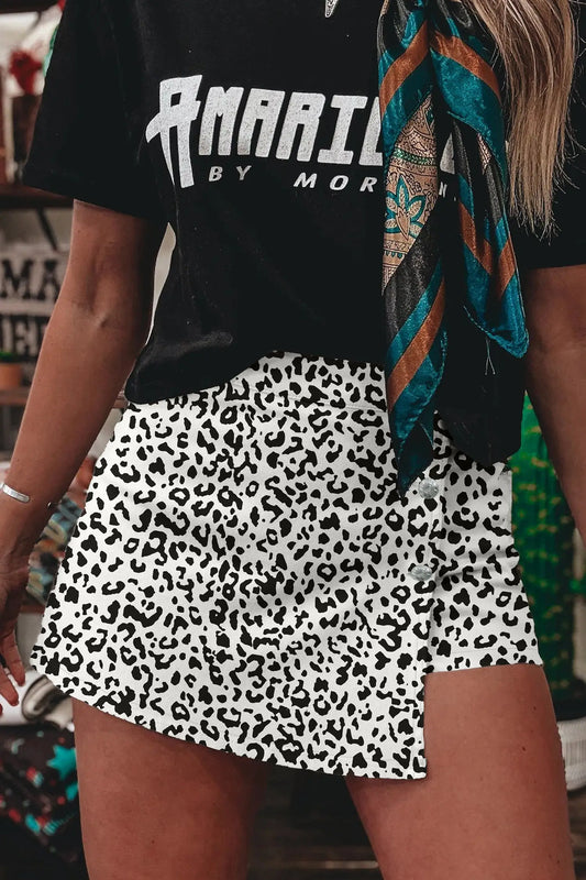 Woman wearing leopard print high waist button overlap denim shorts, front view, Fashionfitz UK