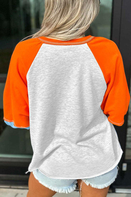 Back view of the Hello Pumpkin sweatshirt showing light grey body with vibrant orange raglan sleeves and blue cuffs, ideal for layering in autumn.