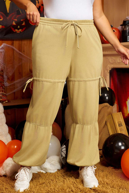 Front view of beige plus size Terry Knit Drawstring Sweatpants with adjustable ties and elastic waistband, perfect for cozy spring outfits.
