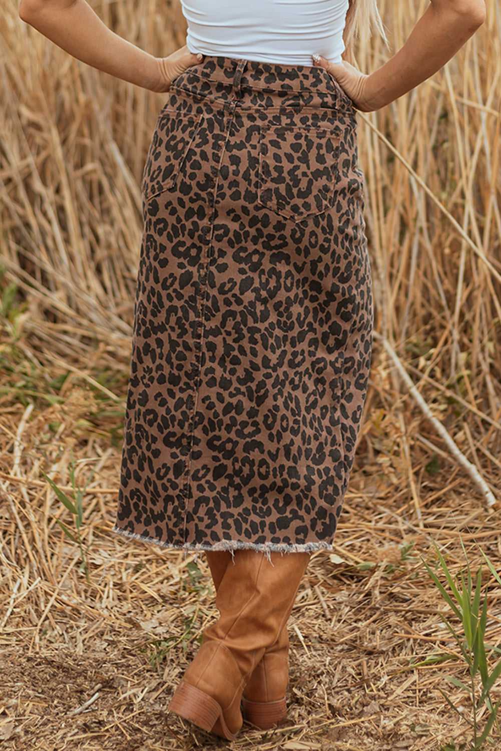 Back view of Leopard Denim Midi Skirt - Summer Fashion by FashionFitz showing rear pockets and raw hem finish.