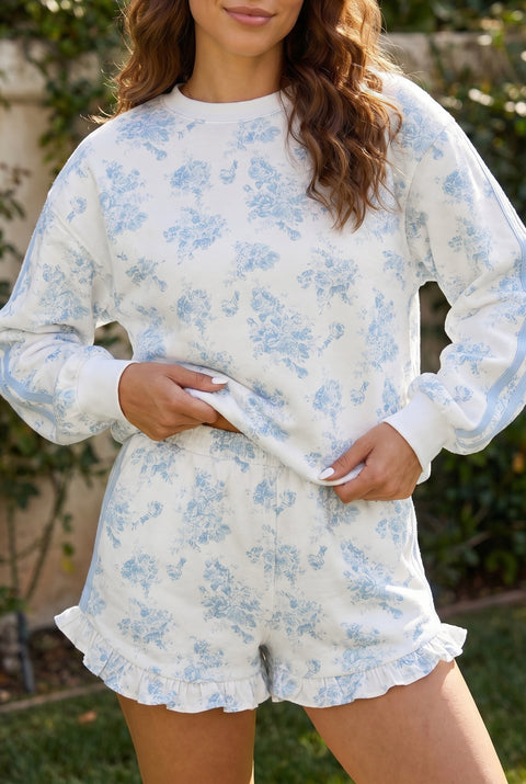 Sky blue floral print long sleeve top and ruffle hem shorts co-ord set front view — Fashionfitz UK