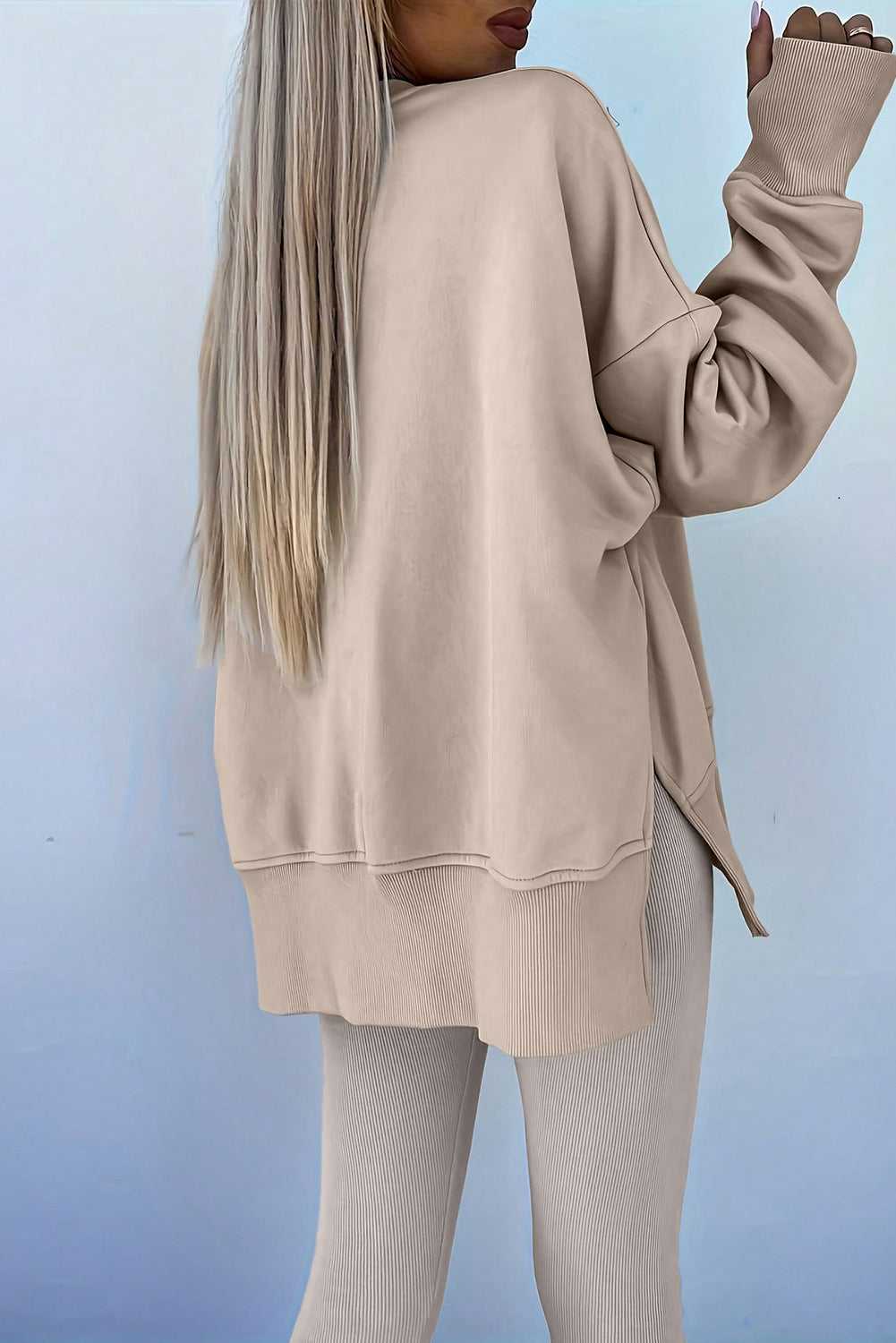 Back view of beige Oversized Sweatshirt and Leggings Matching Set, emphasizing the oversized silhouette and ribbed knit leggings.