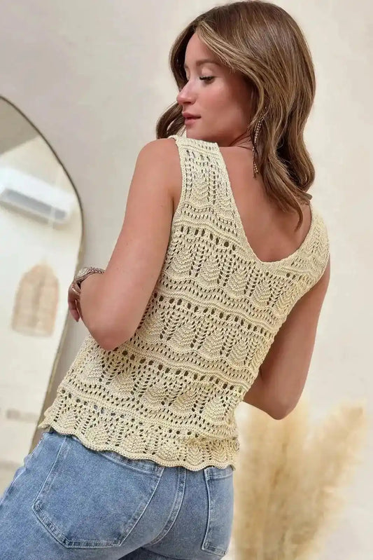 Back view of apricot V-neck crochet vest showcasing intricate knit pattern and scalloped hem, perfect for elegant layering.