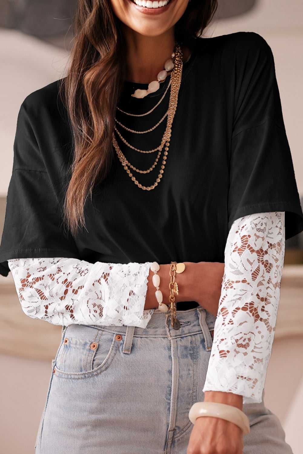 Model wearing the Lace Sleeve Drop T-Shirt - Soft & Comfy | FashionFitz, styled casually with jeans and layered necklaces for a chic look.