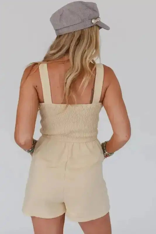 Back view of Beige Shirred Playsuit with wide straps and elastic waist, perfect for casual summer outings and daily wear.