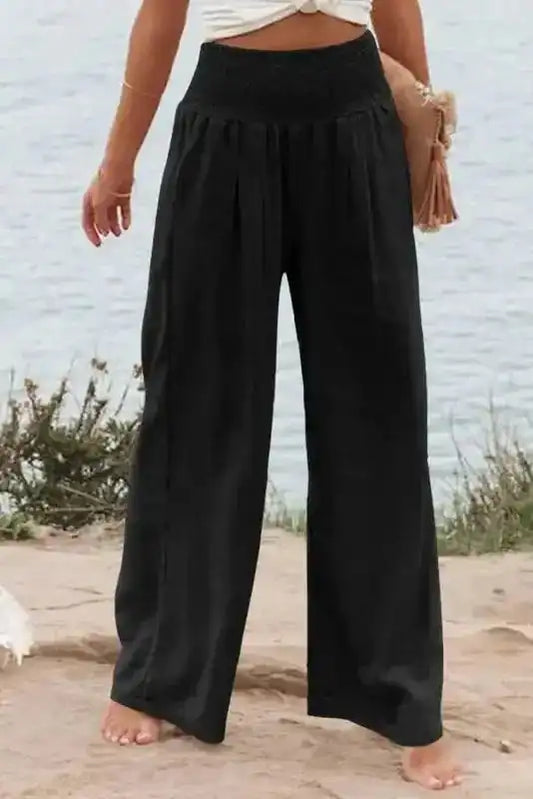 Black Shirred Wide Leg Pants for plus size women with high waist and relaxed fit, ideal for casual wear or vacation outfits in the UK.