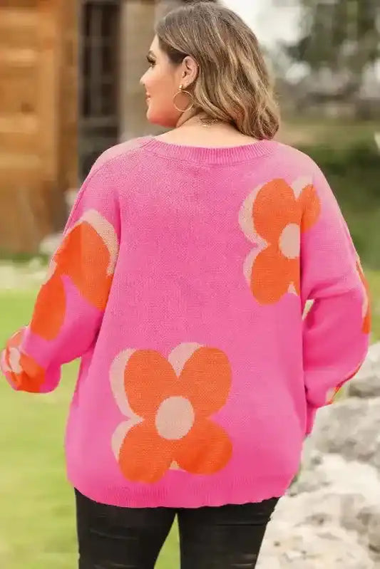 Back view of Bonbon Plus floral sweater showcasing bold flower print and relaxed fit, ideal for fall fashion layering.