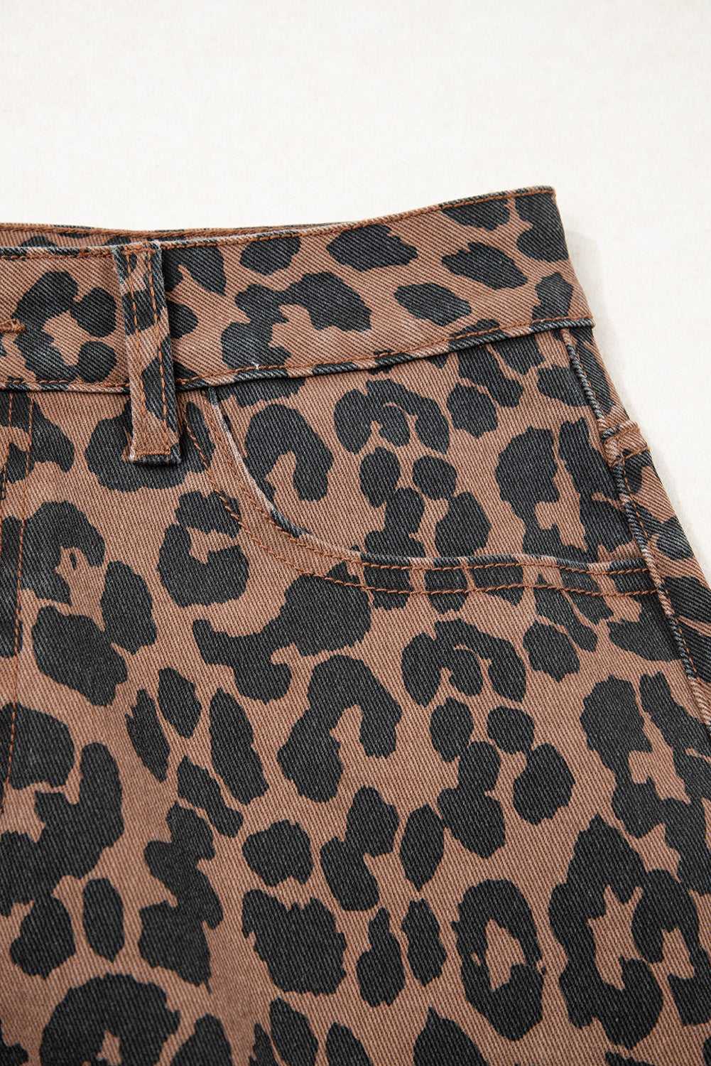Close-up of waistband and belt loops on Leopard Denim Midi Skirt - Summer Fashion by FashionFitz, showcasing durable denim stitching.