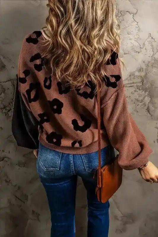 Back view of Coffee Leopard Print Colorblock Pullover Sweater showing brown base with black leopard spots and contrasting sleeves.