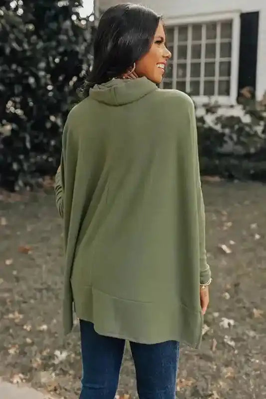 Back view of the olive green Cowl Neck Shift Tunic Top showing its relaxed fit and draped hem, ideal for casual winter wear.