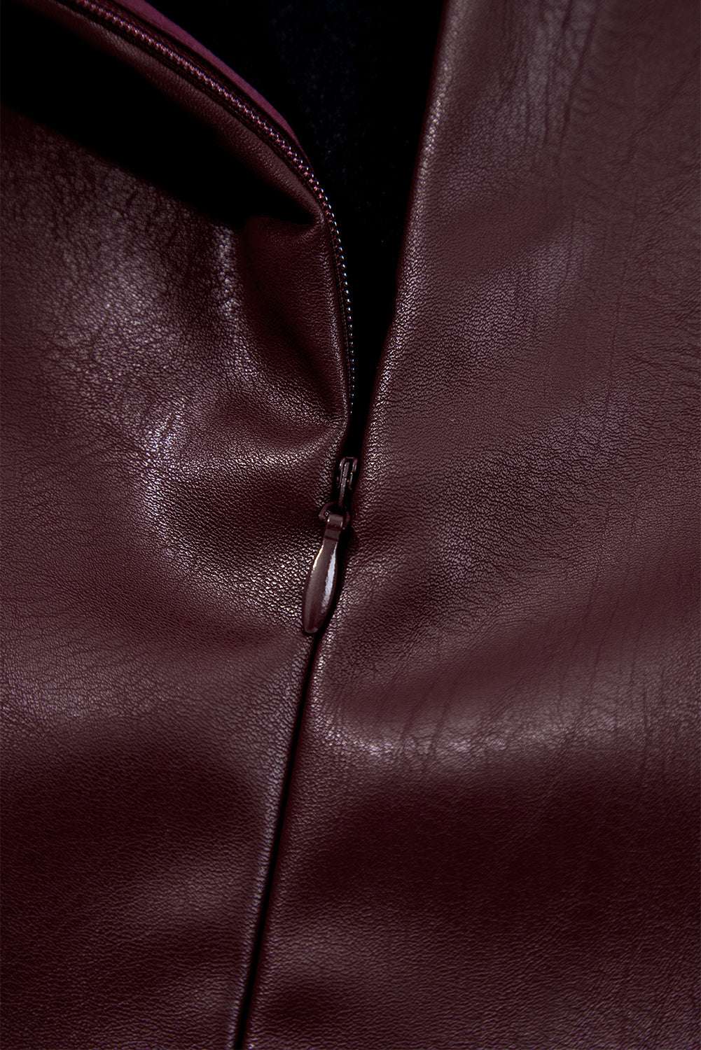 Close-up of zipper on Brown Faux Leather Sleeveless Mini Dress highlighting the high-quality PU leather material and stitching.