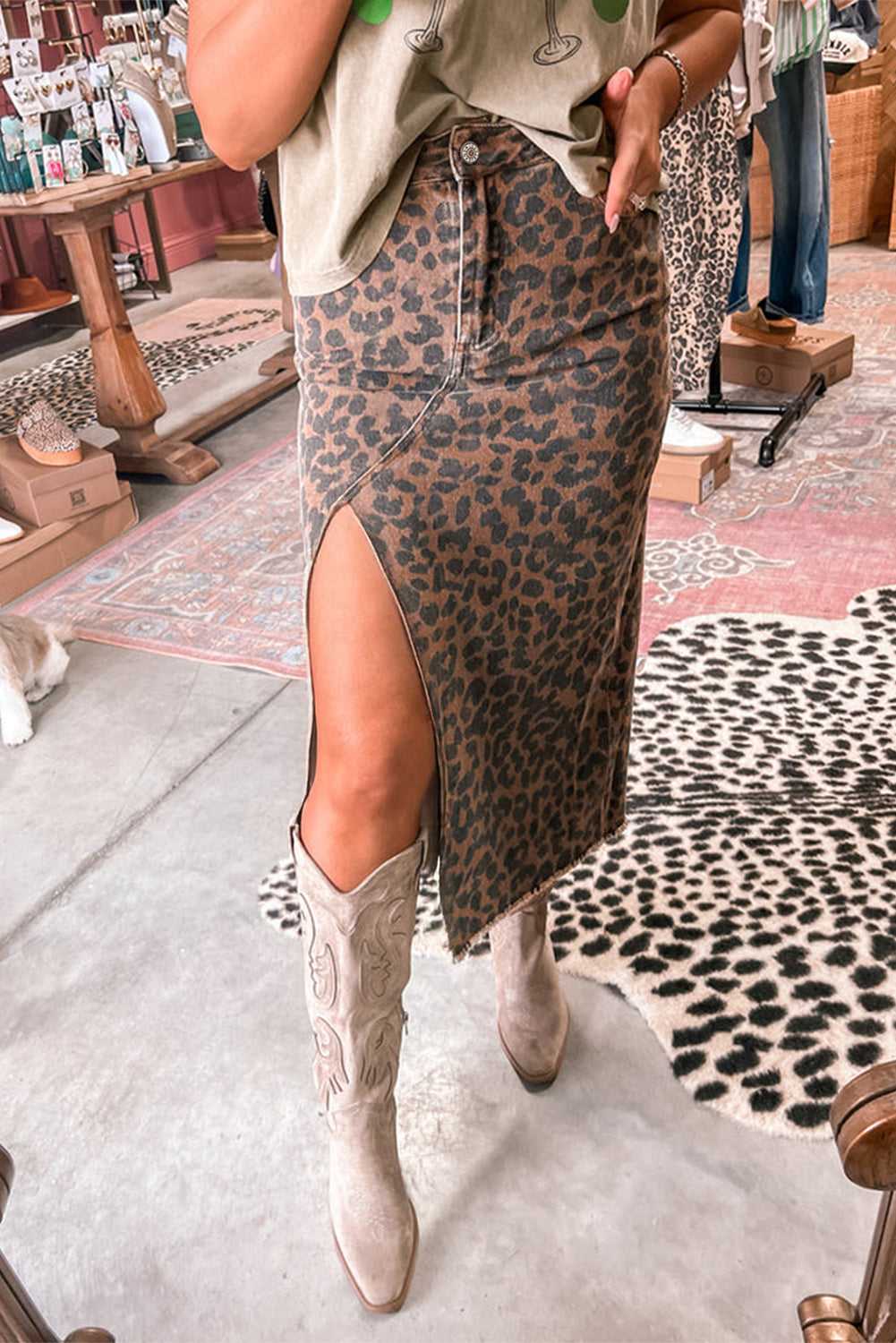 Model wearing Leopard Denim Midi Skirt - Summer Fashion by FashionFitz with high slit and western boots, styled for casual chic.