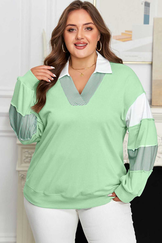 Curve Jade Stripe V‑Neck Sweatshirt for Women with white collar and striped sleeve accents, styled for plus size casual wear.