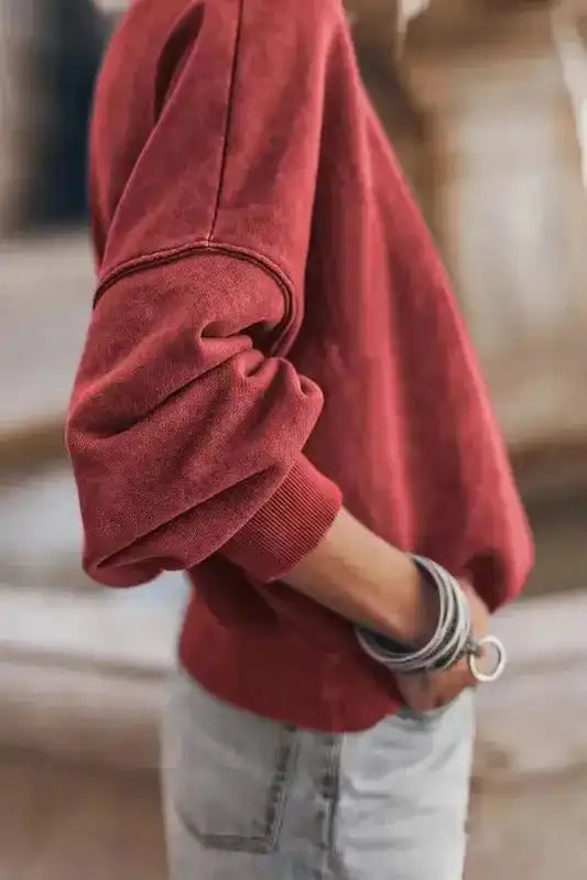 Side view of red Drop Shoulder Crew Neck Sweatshirt showing relaxed fit and ribbed cuffs, ideal for daily casual wear.