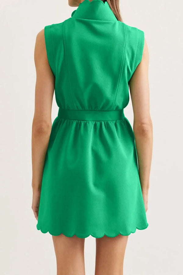 Green mini dress — scallop hem detail close-up, zip-front neckline