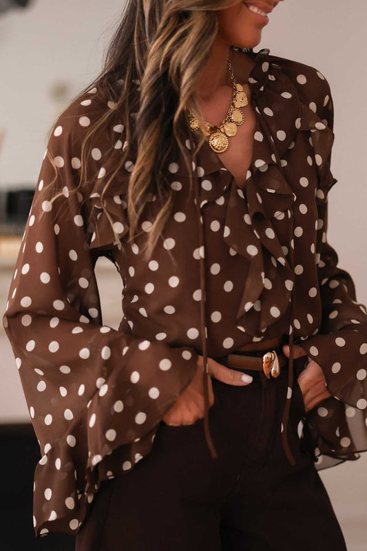 Chiffon coffee polka dot blouse with ruffled bell sleeves and tie neck detail. Lightweight and stylish for elegant or office outfits.