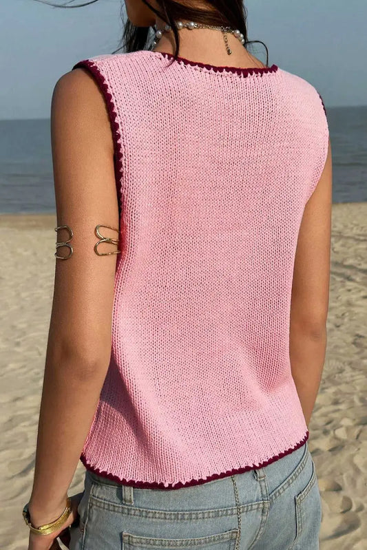 Back view of pink contrast trim knit crop top showing sleeveless cut and breathable summer knit fabric, ideal for casual wear.
