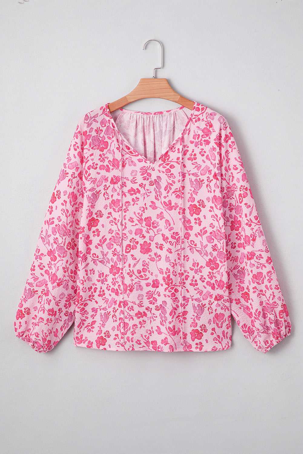 Model wearing Pink Floral Lightweight Blouse with jeans, styled for a chic and casual spring outfit.