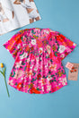 Pink Floral Smocked Short Sleeve Blouse Women UK — front view showing stretchy smocked bodice and vibrant pink floral print — Fashionfitz