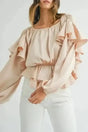 Elegant Ruffled Peplum Keyhole Back Blouse Women UK in oatmeal — front view showing cascading ruffles and peplum silhouette — Fashionfitz