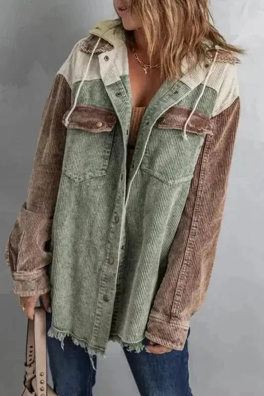 Woman wearing green colour block hooded corduroy jacket with button-down front Fashionfitz UK