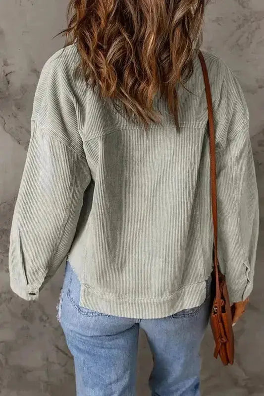 Side view of sky blue cropped corduroy jacket showing raw hem finish and relaxed fit Fashionfitz UK