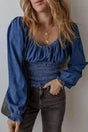 Blue Denim Smocked V-Neck Ruffle Sleeve Blouse Women UK — front view showing smocked bodice, V-neckline and ruffle sleeves — Fashionfitz