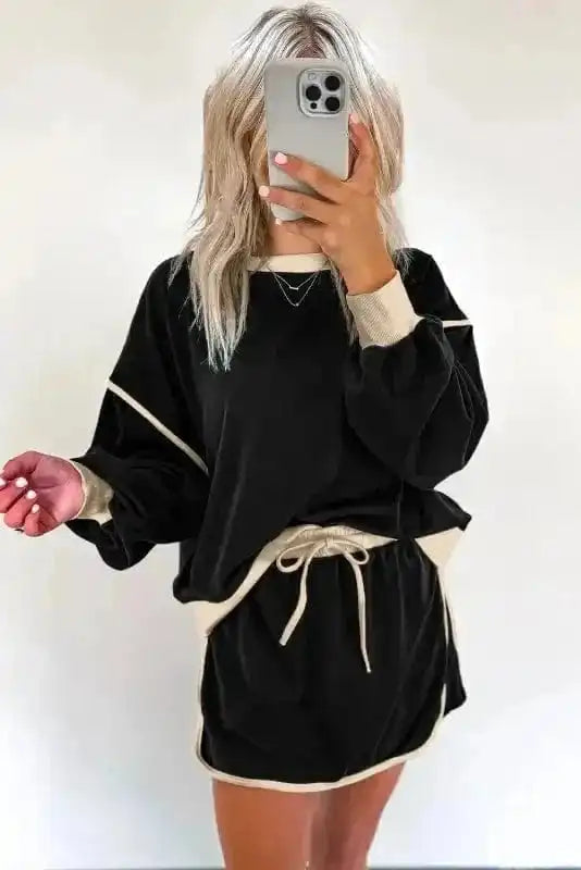 Two Piece Dresses Noir Chic Pullover and Skort Set