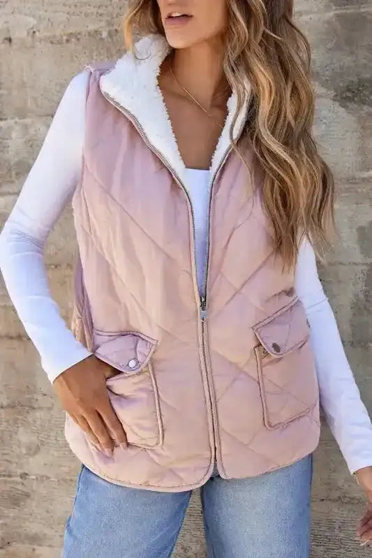 Women's Fleece Lined Quilted Vest Winter Gilet in pink with front zipper and flap pockets, styled for casual winter wear by FashionFitz.