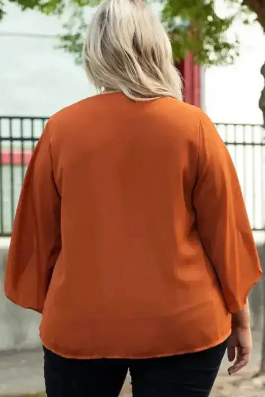 Back view of Gold Flame V-Neck Blouse in plus size, showcasing the smooth drape and relaxed fit of the solid color summer top.